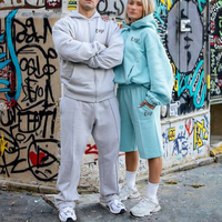 Ensemble de survêtement unisexe Kuest personnalisé gris avec sweat à capuche zippé oversize et pantalon de jogging long, idéal pour l'hiver et les loisirs