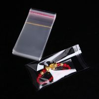 100 pièces Transparent non scellé manchons de jeu cartes de société 65*90mm carte protecteur OPP sacs tueurs magiques de trois