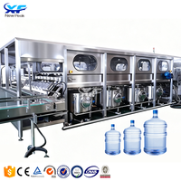 Machine de remplissage d'eau automatique NewPeak 5 gallons (20 litres) pour barils PET, machine d'embouteillage d'eau minérale haute précision 5 gallons