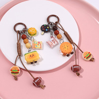 Porte-clés amusant en forme de biscuit burger de dessin animé, mignon et créatif, jouet alimentaire ludique, pendentif pour la décoration de clés et sacs, design en caoutchouc