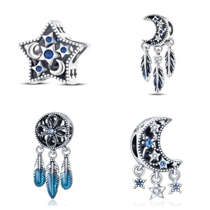 Bohemian-style star and moon pendant, set with blue zircon and feathers, made of vintage <b>silver</b>-plated white brass - Product Image 1