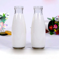 Bouteilles en verre transparent en gros, haute performance, spécifications de taille pour lait, yaourt et boissons, canettes à fruits