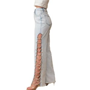 กางเกงยีนส์ขากว้างประดับคริสตัลและเพชรพลอยสำหรับผู้หญิงจากโรงงานเสื้อผ้ากวางโจว ดีไซน์สวยงามพร้อมดีเทลตัดข้างและตกแต่งด้วยอัญมณี - Product Image 1