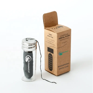 <span class=keywords><strong>Fil</strong></span> de charbon de bambou <span class=keywords><strong>Fil</strong></span> <span class=keywords><strong>dentaire</strong></span> en PTFE Ciré avec cire d'abeille <span class=keywords><strong>naturelle</strong></span>, menthe, saveurs d'agrumes OEM/ODM Commande en gros personnalisée à bas quantité minimale de commande - Product Image 1
