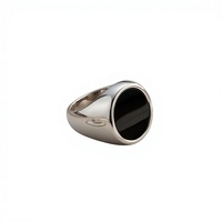 Bague classique ovale en acier inoxydable poli pour homme, avec résine noire et coquille, best-seller transfrontalier Europe-Amérique 2025