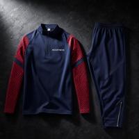 Conjunto de chándal de 2 piezas para hombre con cremallera de cuarto, manga raglán, estampado contorneado, pantalones de chándal cónicos con cintura elástica y cremallera en el tobillo, producción OEM
