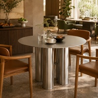 Table à manger minimaliste de style italien en acier inoxydable résistant aux rayures, personnalisable, avec pieds à trois colonnes, inspirée des designers