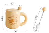 Tasse à café en céramique de haute qualité avec couvercle Capacité de 480ml Résistant à la chaleur Conception de dessin animé mignon Durable pour une utilisation au bureau