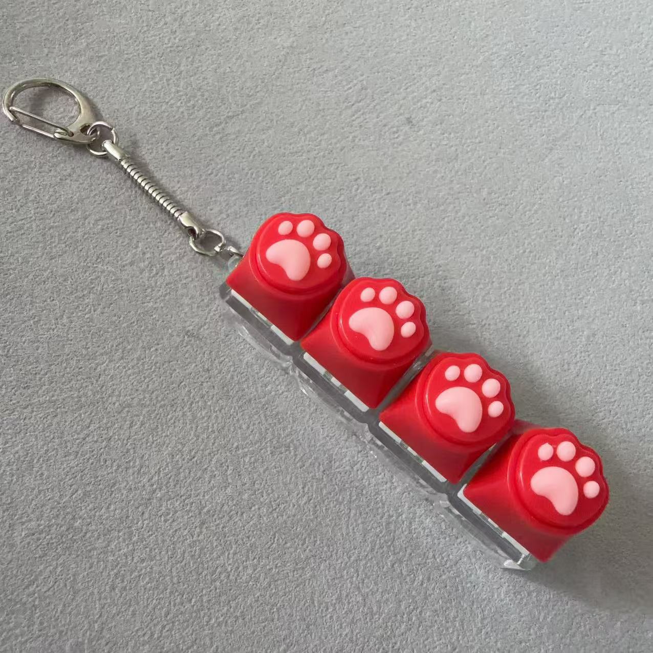 Coque transparente à quatre boutons - patte de chat rouge en silicone