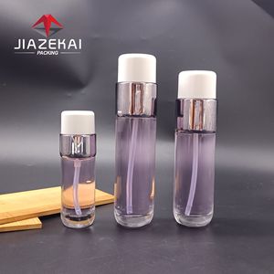 Ensemble de soins de la peau Bouteille en verre vide transparente de 120ml pour lotion <span class=keywords><strong>Essece</strong></span> et pompe Matériau d'emballage cosmétique Logo imprimable - Product Image 1