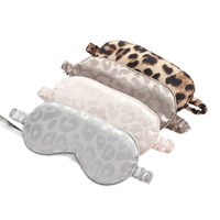 Ensemble cadeau 4 pièces personnalisé avec logo, imprimé léopard, respirant et minimaliste, comprenant un masque de sommeil, un chouchou en fausse soie, un bandeau et un sac de rangement