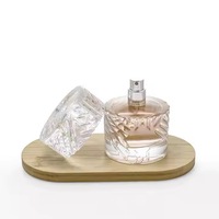Couvercle en verre unique Bouteille de parfum Cylindre 50ml Bouteille de parfum Conception à motifs Emballage de parfum en verre entier
