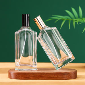 Vente directe d'usine, design unique, flacon de parfum en verre transparent carré plat de 100 ml avec vaporisateur fin et couvercle - Product Image 1