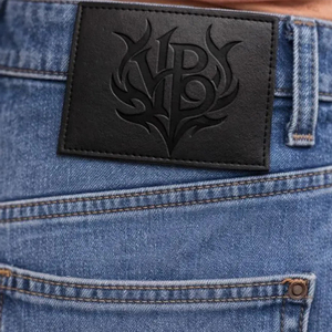 Guangzhou Lefeng Manufacturer Custom Debossed Logo Leather Brand Tag Handmade <strong>Black</strong> Leather Patch <strong>Labels</strong> For <strong>Jeans</strong> Garment - Product Image 1
