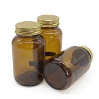 Bouteille en verre ambré avec bouchon à vis en aluminium et couvercles métalliques pour comprimés et capsules, avec scellage par induction thermique – Approvisionnement direct usine