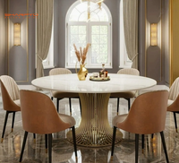 Table à manger ronde de luxe avec plateau en marbre et structure en acier inoxydable brossé doré pour la maison et l'hôtellerie