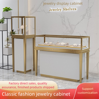 Vitrine à bijoux avec éclairage LED, support en métal et comptoir en verre pour vitrine de magasin