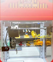Mini machine à pinces pour peluches - Ensemble cadeau de jeu de grue d'arcade avec animaux porte-clés, balles en caoutchouc et bonbons