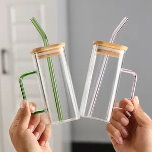 Produttore vasetti di vetro con manico riutilizzabile da viaggio ghiacciato tazza di vetro trasparente coperchio di bambù colorato tumbler con paglia