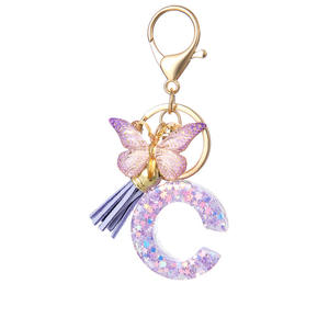 Copper <b>LED</b> Keychains with 26 English Letters purple <b>Star</b> Tassels Doll Pattern Safe Feature for Ladies' Students' Bags Pendants - Product Image 1
