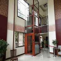 Modern Villa Hidrolik Asansör Cam Kabinli Konut Asansörü Zarif Tasarım Dış Mekan PVC Zeminli Yolcu Platformu Küçük Alanlar İçin
