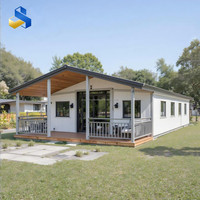Maison conteneur moderne extensible prête à l'emploi 2025, panneau sandwich, conception spacieuse pour atelier ou utilisation en parc, garantie 4 ans