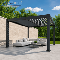 Pergola élégante à toit à persiennes, structure en aluminium avec système motorisé et cuisine extérieure pour les fêtes de jardin