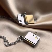 Nouveau design en acier inoxydable de bijoux étanches tendance pour mini couple livre d'amour médaillon pendentif collier