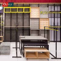 Présentoir à vêtements en acier inoxydable OUYEE pour magasin de détail, support personnalisé pour chemises en tissu