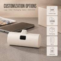 Mini batterie externe portable avec câble de charge intégré et écran LED numérique pour smartphone, idéale pour une utilisation quotidienne en poche