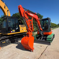 Mini-excavatrice sur chenilles Kubota U55-5 d'occasion, 5,5 tonnes, avec pince hydraulique, attache rapide, moteur EPA, prête à l'emploi