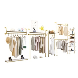 Listo para enviar, estante de ropa de Metal bonito a la moda, estante de ropa montado en la pared dorado de acero inoxidable para exhibición de <span class=keywords><strong>tienda</strong></span> de mujeres Boutique - Product Image 1