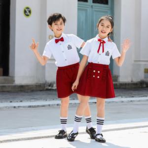 Gran oferta, logotipo personalizado, precio al por mayor, Polo de algodón orgánico blanco con falda roja, conjunto de uniforme escolar Unisex para niños - Product Image 1