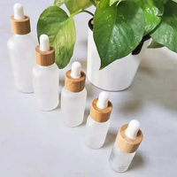 Flacon élégant en verre dépoli pour huiles essentielles 10ml 15ml 30ml 60ml avec compte-gouttes en bambou pour sérum et emballage de soins de la peau