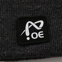 Bonnet d'hiver en tricot jacquard color block personnalisé OEM avec pompon et patch tissé