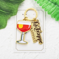 Porte-clés en alliage de zinc doré en forme de poupée, avec logo émaillé et slogan espagnol, personnalisé, pour cadeau d'appréciation pour infirmières