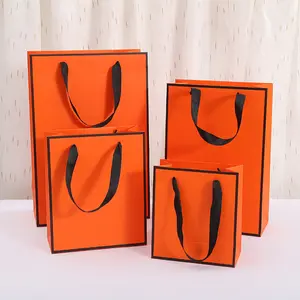 Großhandel orange quadratische Parfüm-Souvenir-Geschenkbox Himmel Erde Abdeckungsmerkmale Prägung glänzende Lamination UV-Schicht lack