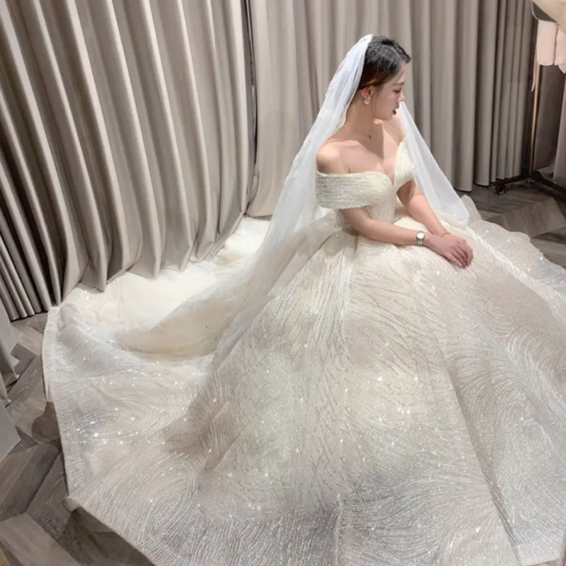 セクシーな結婚式のためのトルコの白いドレスのブライダルシャララドレス結婚式の豪華なスパンコールレースのウェディングドレス