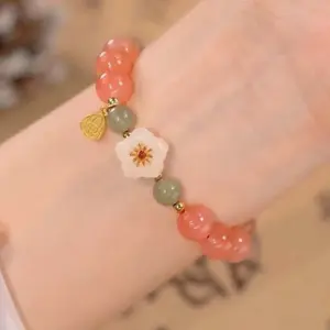 Commercio all'ingrosso di Design di nicchia Burst Flower Warm Plump Light Luxury studenti regalo braccialetto di perline di giada naturale ragazza