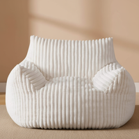 Fauteuil pouf contemporain en velours côtelé pour salon moderne, confortable et inclinable, style minimaliste