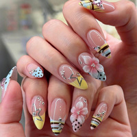 Vente en gros de faux ongles en acrylique de style français en forme d'amande |   Ongles personnalisables aux couleurs pastel avec motifs à pois, étoiles et fleurs