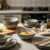 Service de vaisselle en céramique EKA gris avec glaçure réactive et bordure marron, assiettes rétro et bols à dessert pour la maison, les cafés et les restaurants (vente en gros)