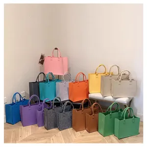 Bolso Tote de fieltro personalizado al por mayor, dos correas, varios colores, forro de piel auténtica, informal, flor de caramelo, logotipo incluido