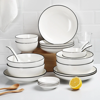 Vaisselle de ménage Vaisselle de restaurant en porcelaine à bord noir Bol en céramique pour soupe blanche de riz européen au micro-ondes