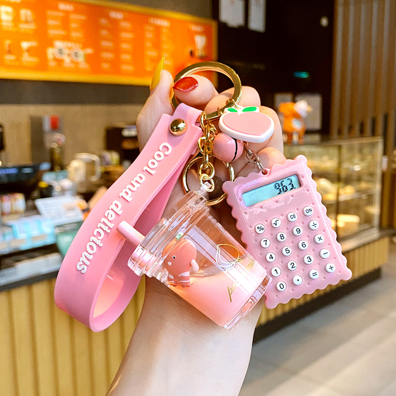 Xinxing Fashion Cute Hairy Ball Flowing Liquid Key Chain Milk Bottle Crystal KeychainComputer Nail Clipper Key Chain Bag Pendant