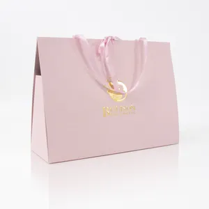 热卖纸质购物袋定制标志粉色精品礼品袋带丝带压花礼品袋