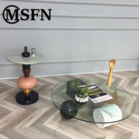 Table basse moderne en verre rond avec bases géométriques en marbre pour salon, villa, hall d'hôtel