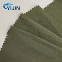 Tissu en taffetas de nylon 30D tissé froissé enduit de PA résistant aux UV, léger et doux pour la peau, idéal pour les vestes