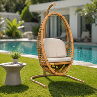 Fauteuil suspendu en rotin tressé avec coussin, design moderne, pour usage extérieur en parc