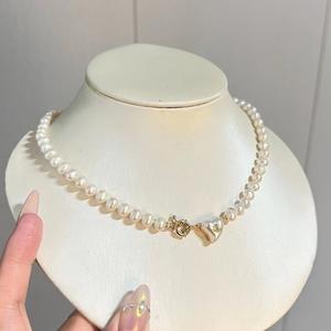 Collier de luxe haut de gamme en perles d'eau douce naturelles pour femme, perles de millet avec pendentif nœud léger et luxueux pour la clavicule - Product Image 2